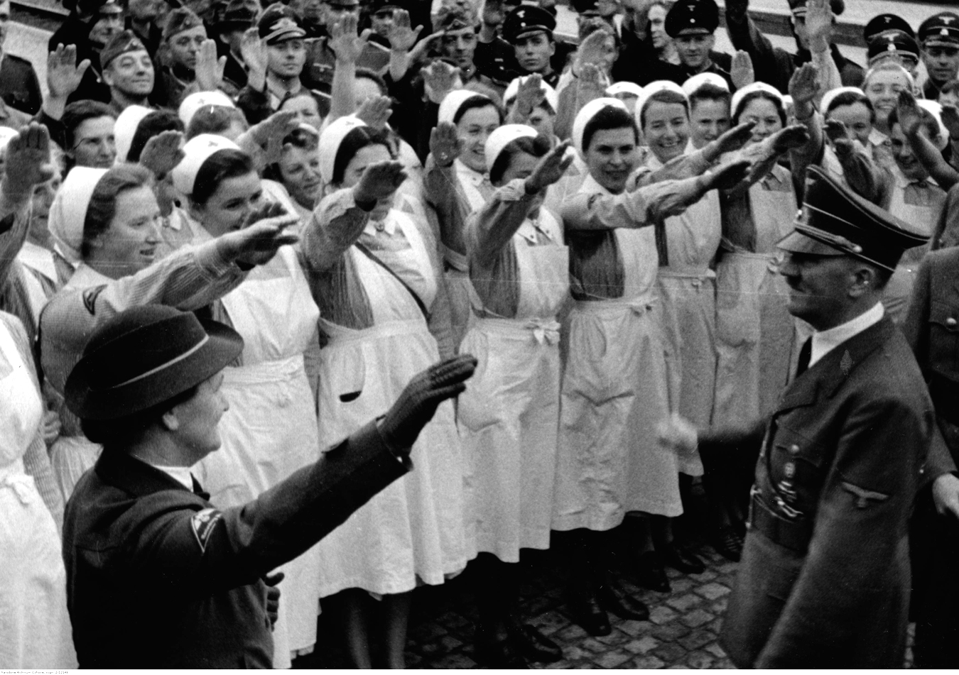 Adolf Hitler is greeted by a group of nurses at Marienburg station after his meeting with admiral Horthy
